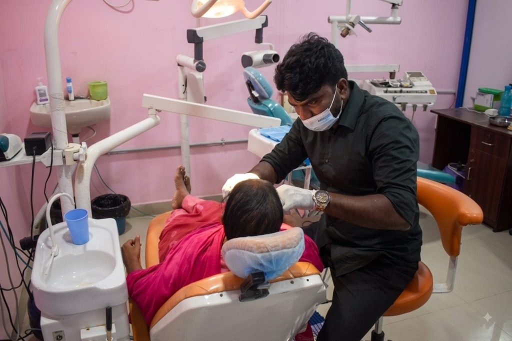 Dr. Jemison Paul providing dental treatment at Magna Dental Clinic