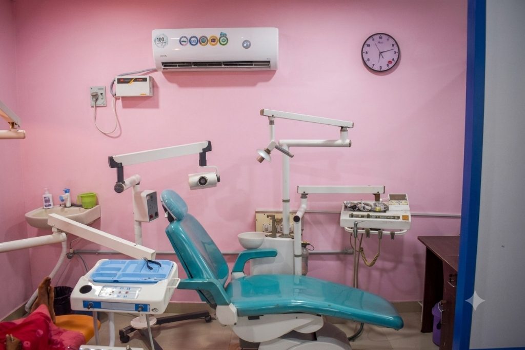 Dental treatment room at Magna Dental Clinic with teal dental chair